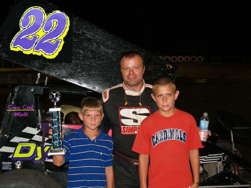 Mike in victory lane with his two sons Avery(left) and Lane(right)